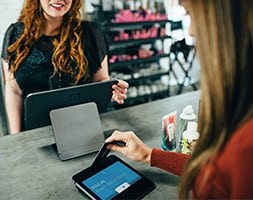 Woman Paying for Goods Using Her Card