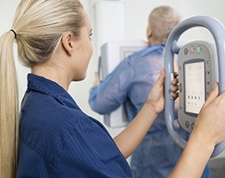 Female Medical Practiioner Facing Screen of her Medical Equipment