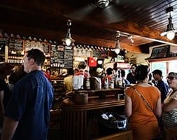 Busy Cafe with Customers Waiting In Queue
