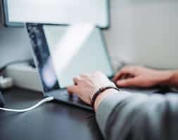 Man Working with A Laptop on A Desk