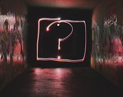Dark Room With A Question Mark Sign in The Hallway