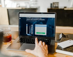 Man Facing Laptop Working on A Website
