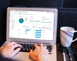 Man Looking At Google Analytics Report