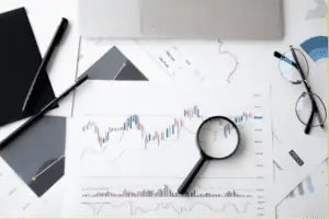 Magnifying glass on top of documents.