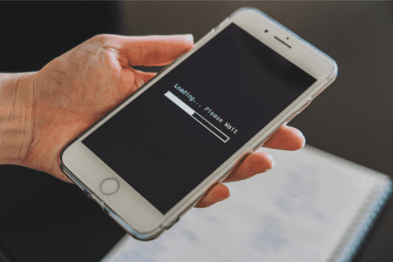 Close Up Photo of A Hand Holding A White Phone