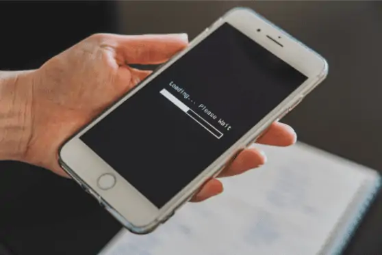 Close Up Photo of A Hand Holding A White Phone