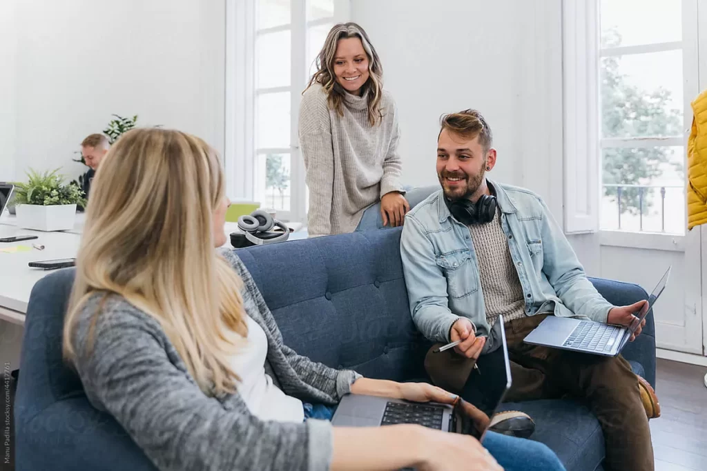 A Man and 2 Women In a Happy Discussion