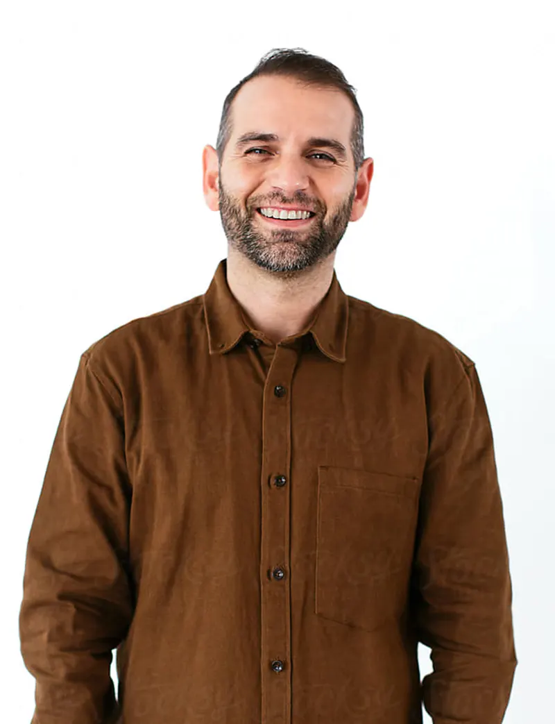Smiling Man in Brown Jacket