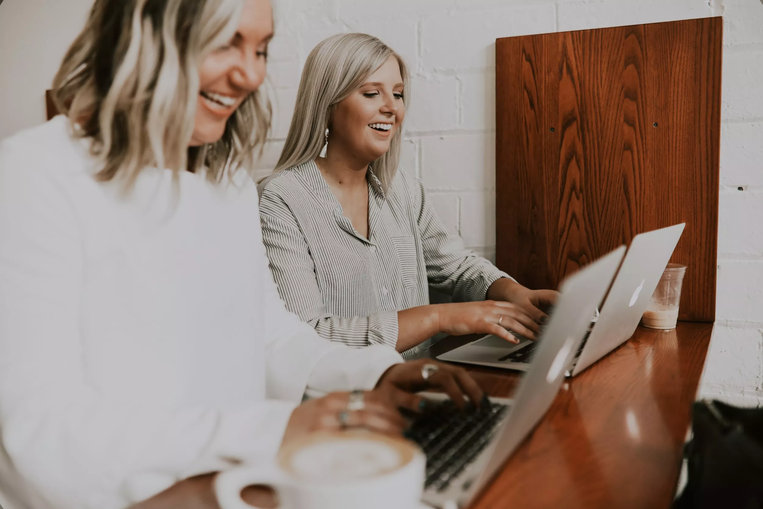 Two Women Smiling at Work