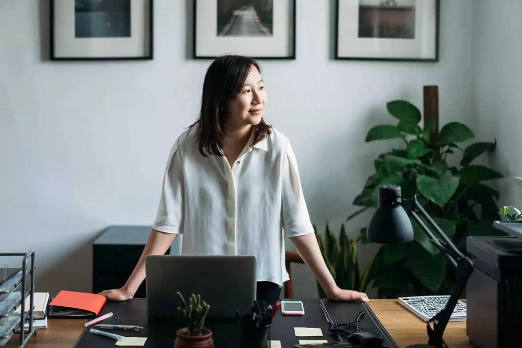 Woman With A Laptop Facing Sideway