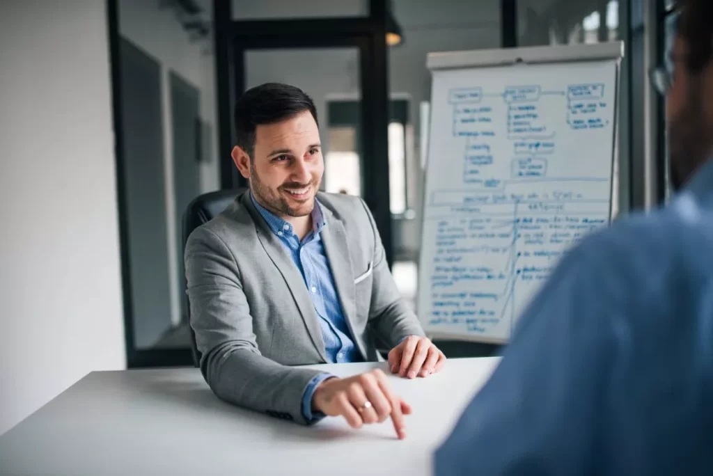 Man in Corporate Suit Talking Happily