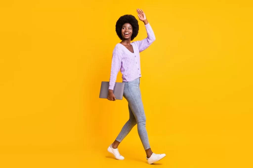 Woman Saying Hi in Yellow Background