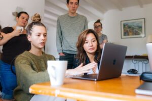 Web Designers Brainstorming in Front of A Laptop