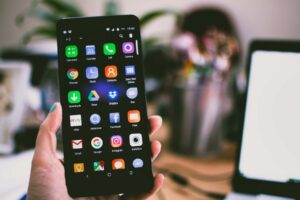 Person Showing Mobile Phone Menu