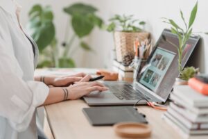 Woman Typing On A Mac Computer