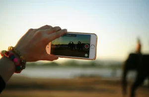 Person Taking A Photo of An Elephant